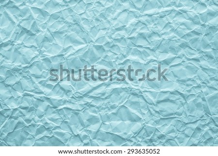 texture of old crumpled paper closeup of azure turquoise color for empty and pure backgrounds