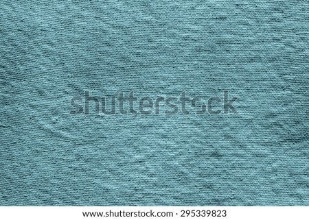 the abstract interlace textured background of dark turquoise rough fabric for empty and pure layers