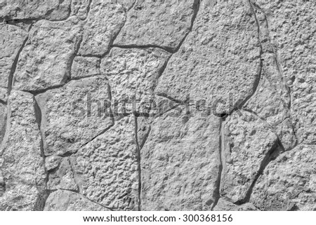 abstract texture of gray color of a stone wall with cracks for empty and pure backgrounds and for wallpaper