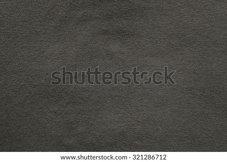 the textured background from fabric of thin cotton material of gray beige color and a blank space for the text