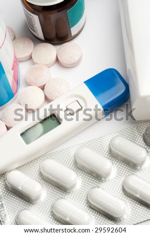 pill containers, tablets and thermometer