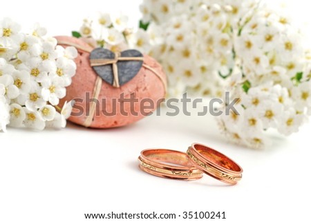 wedding bands and white flower, with heart