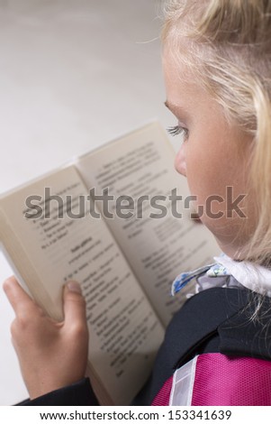 School girl is reading