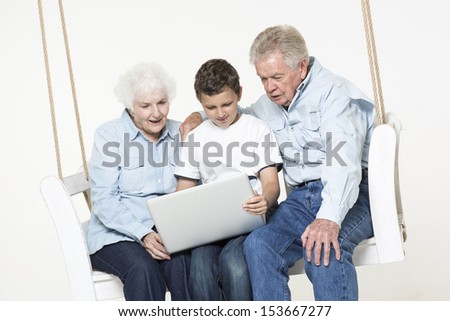 Grandson explains computer problems to grandparents