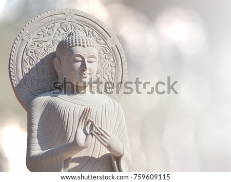 The White Stone Buddha Statue With Light Bokeh background in BanDen temple in Chiang Mai, Thailand for background or textures and other. Close up.