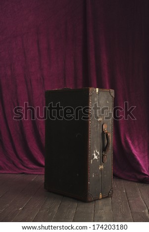 old suitcase on the stage in the theater.