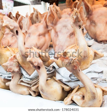 Chicken and Pig\'s head at the market