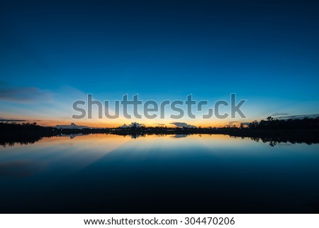 Sunset landscape with blue sky at the calm lake