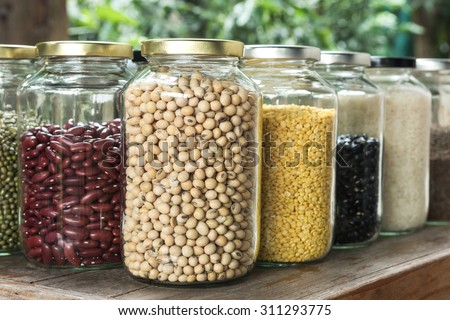 Close up Soybean in a glass jar with multi colour bean