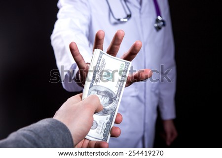 close-up doctor takes money
