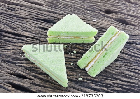 green chiffon cake on wooden board