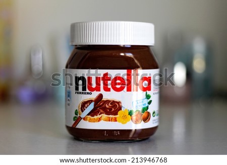 PARIS - FEB 22, 2012: Jar of Nutella Hazelnut on a bokeh background. Nutella is the brand name of a chocolate hazelnut flavored sweet spread by the Italian company Ferrero.