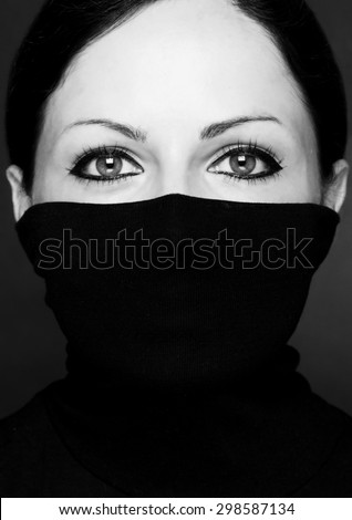 Fashion portrait of a woman with black polo neck\
Look at woman eyes \
Black and white photo