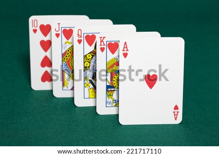 Closeup of heart royal flush the highest ranking hand in hold\'em poker in horizontal view