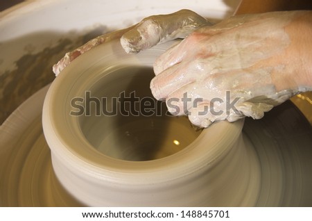 Potter\'s Hands throwing a pot