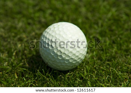 Golf club view of Golf ball in the putting green - sport