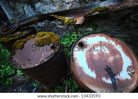 Empty rusting toxic chemical barrels