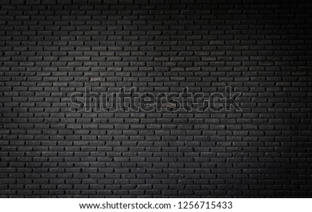 Black brick wall texture, brick surface background. Vintage floor wallpaper.