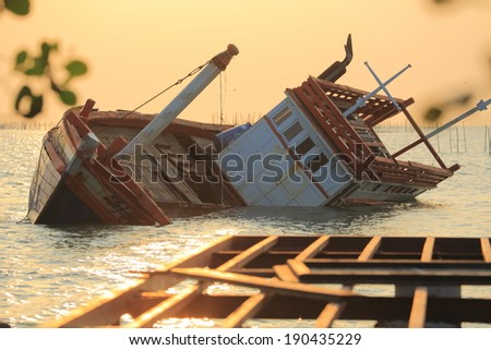 Fishing boat sinking in a sea of Thailand