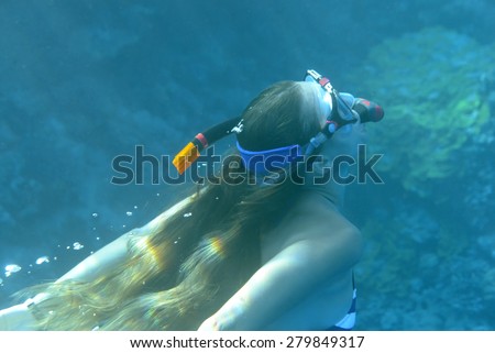 Young woman in scuba diving in the Red Sea