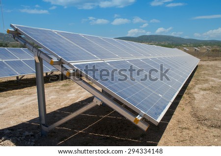 Row of photovoltaic solar panels in fields of countryside