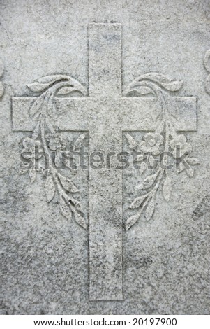 Granite stone made cross with flowers