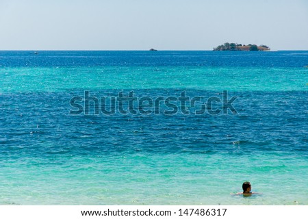 Comodo Islands, Indonesia - August 27: Man floating in the beautiful blue on August 27, 2007 in Comodo Islands Indonesia