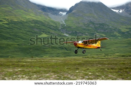 WRANGELL-ST.ELIAS,USA - CIRCA AUGUST, 2010- Small bush-plane landing on a remote airstrip in Alaska near Tebay Lake in Wrangell Mountains.