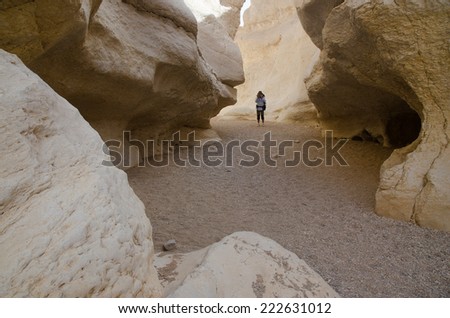 NEGEV DESERT, ISRAEL - CIRCA APRIL,2013 -  Hiker from Europe resting in small canyon in Negev Desert..The Negev  is a desert region of southern Israel and covers more than half of Israel.