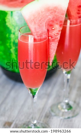 Watermelon bellini cocktail in champagne glass