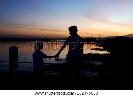 hand in hand and sunset