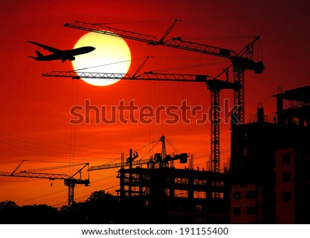 Construction Site and airplane and sun