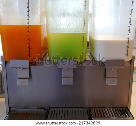 Office cooler with orange juice , guava juice , milk