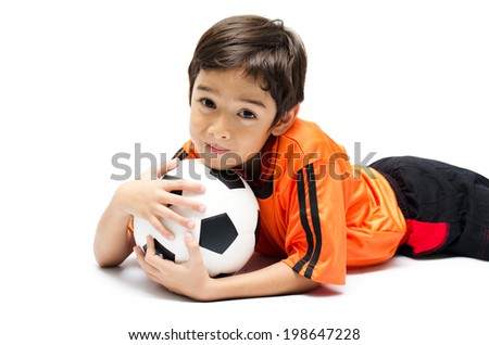 Little boy with football on white background