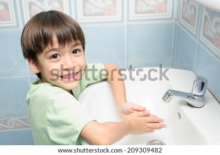 Little boy waiting for washing hand