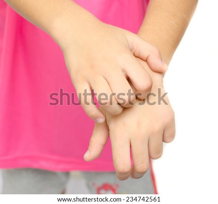 Little boy itchy his hand on white background