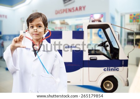 Little kid pretend ans a doctor hospital background