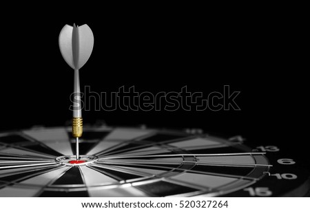 Gray darts hitting the center of target. Dartboard with darts arrow hitting the center.