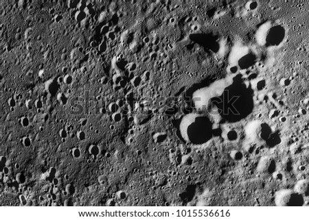 Moon Surface. Image of the Moon showing landing site of Apollo 11 around center of the Moon. Elements of this image furnished by NASA