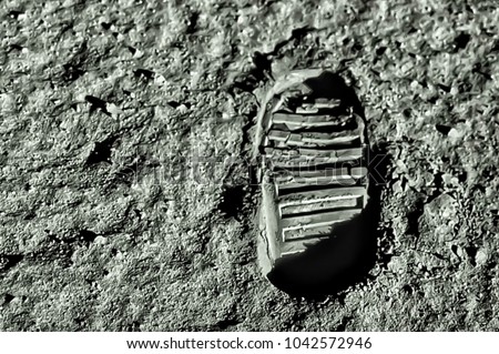 Buzz Aldrin\'s footprint on the moon. Astronaut\'s boot print on lunar moon landing mission. Moon Surface. Image of the Moon showing landing site of Apollo 11. Elements of this image furnished by NASA