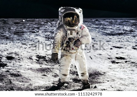 Astronaut on lunar moon landing mission Apollo 11.Astronaut space walk on moon surface in spacesuit.Space,science fiction,galaxy & universe wallpaper. Elements of this image furnished by NASA