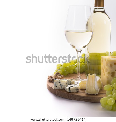 White wine and cheese platter and grapes