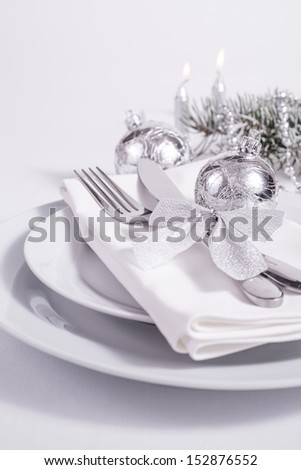 Silver table set with candles for New Year