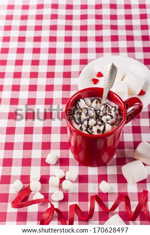 Hot double chocolate and marshmallows in red cup