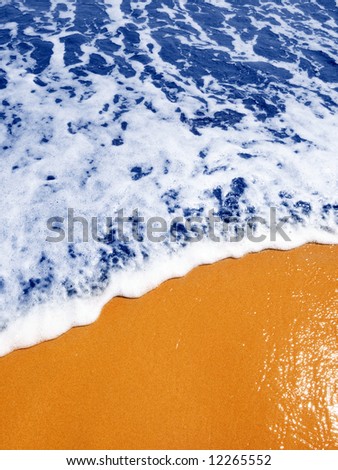 Blue waves on the gilded sand ( High intensity of color)