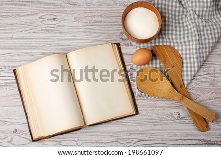 Cooking concept. Ingredients and kitchen tools with the old blank recipe book
