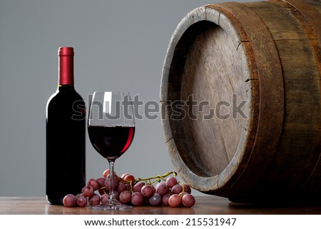 Wine with barrel on wooden table