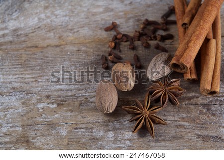 Spices on wooden background. Cinnamon, nutmeg, cloves, anise