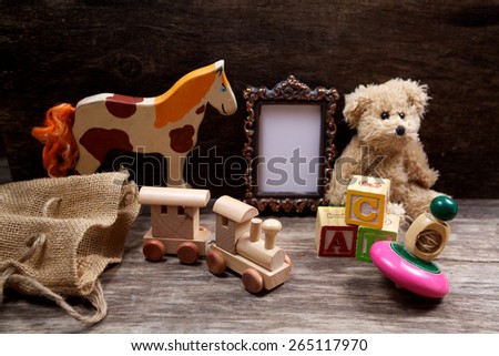 Vintage toys on wooden background