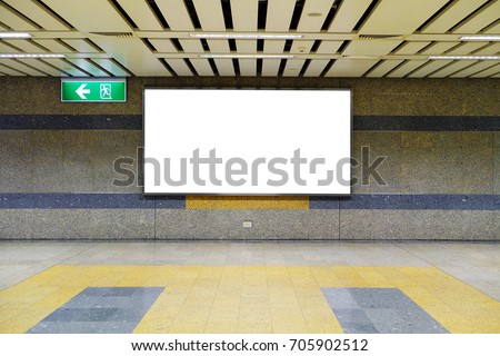 Blank billboard in subway. Useful for your advertising. billboard at under ground or metro train station for advertising design. big horizontal billboard on metro station, advertisement on billboard.